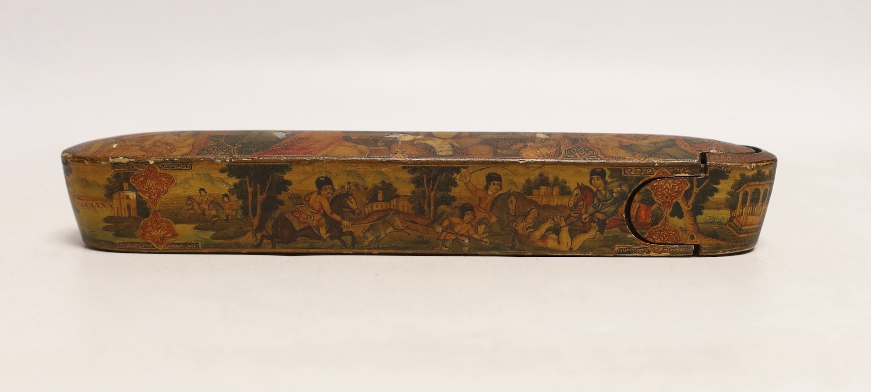 A Persian Qalamdan papier mache scribes or pen box, Qajar dynasty, 22.5cm in length
